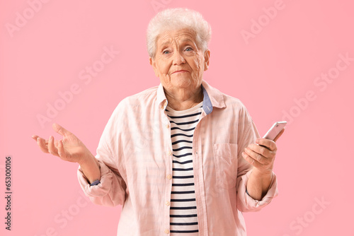 Senior woman with mobile ph...