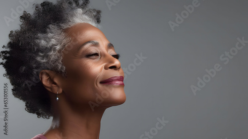 Beautiful gorgeous 50s mid age beautiful elderly senior model woman with grey hair laughing and smiling. Mature old lady close up portrait.	 photo