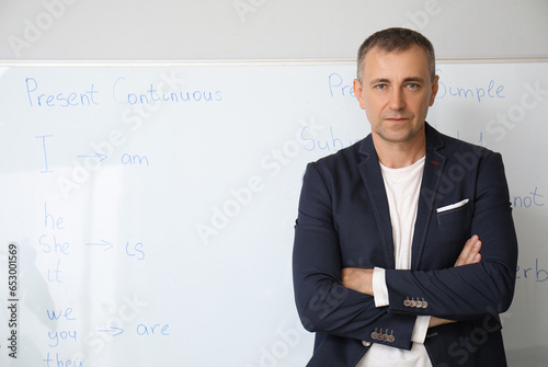 Male English teacher near f...