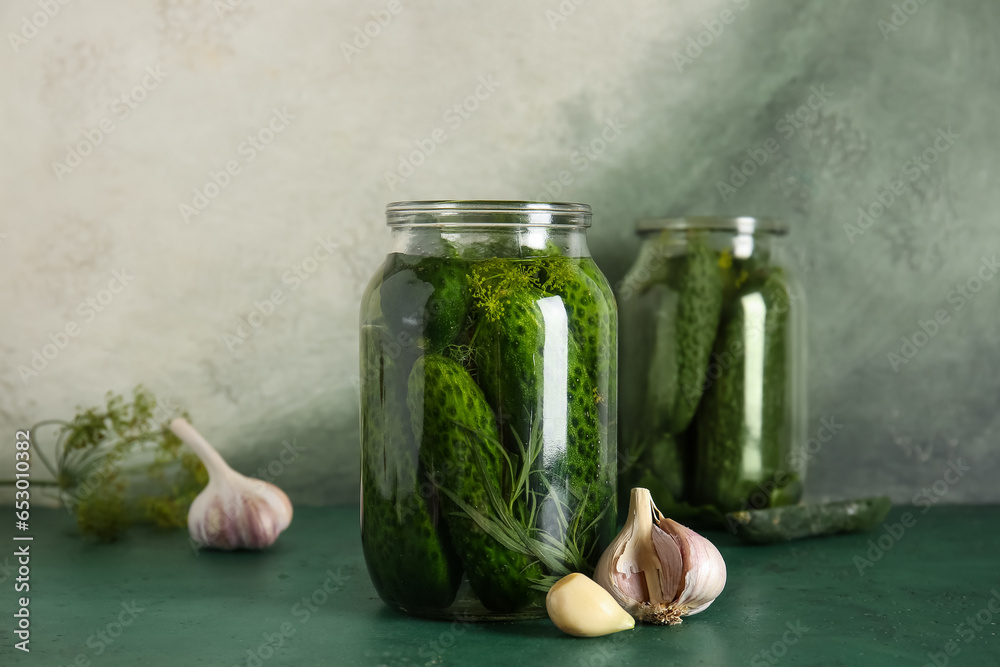 Jar with fresh cucumbers for canning on table Jar with fresh cucumbers for canning on table