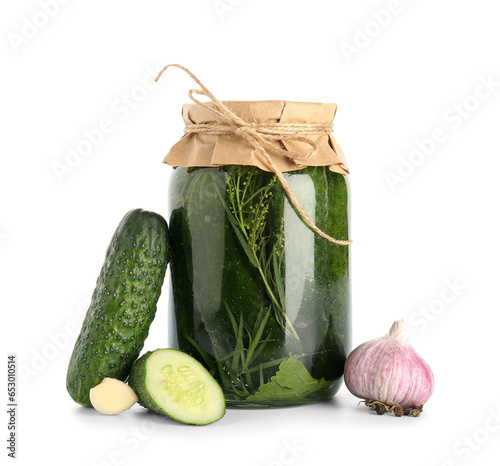 Jar with canned cucumbers and fresh vegetables on white background