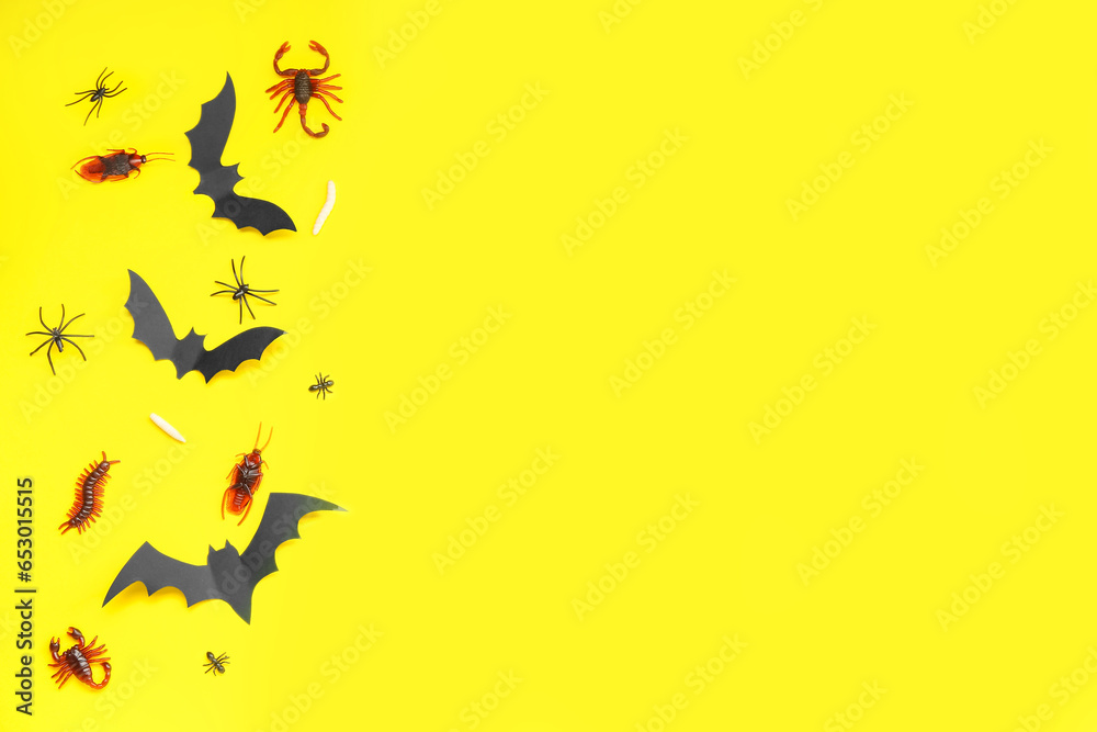 Halloween composition with candy bugs and bats on yellow background Halloween composition with candy bugs and bats on yellow background