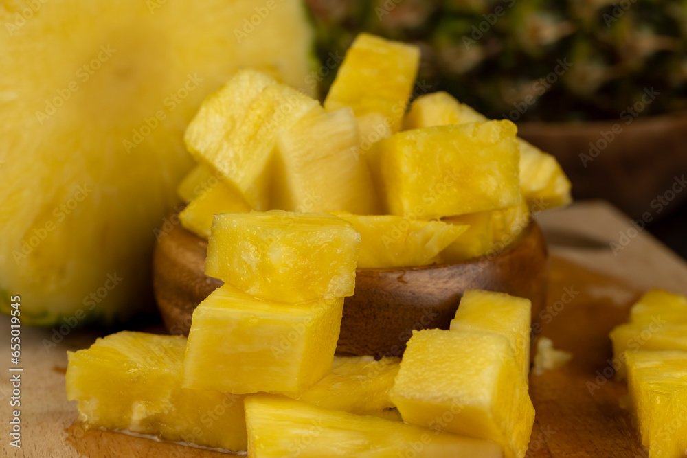 sliced ripe yellow pineapple, a large number of pieces sliced ripe yellow pineapple, a large number of pieces