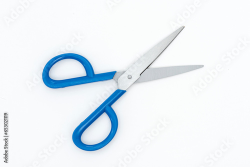 Blue scissors isolated on the white background.