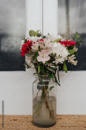 Fototapeta Naklejka Na Ścianę i Meble -  Bunch of bright flowers in a vase