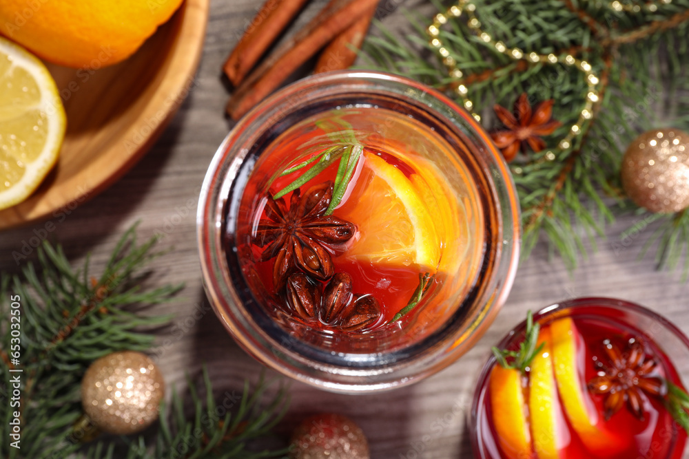 Aromatic punch drink and Christmas decor on wooden table, flat lay