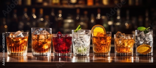 Selection of potent spirits in glasses on bar counter