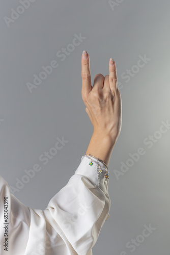 Rock Hand Sign, Rocker Gesture with Fingers, Fingers in Rock Position, Rock & Roll Hand Sign, Rock Expression with Hand