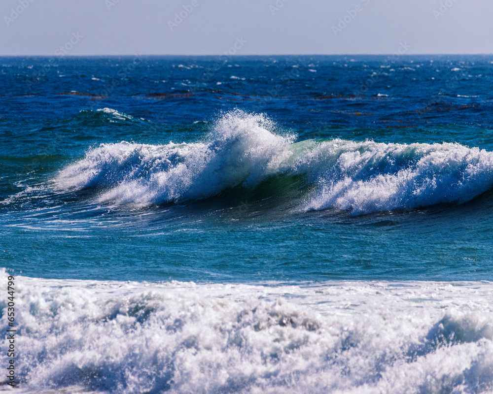 Waves break on the beach at Jalama Beach in Lompoc, CA.