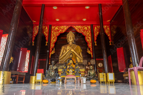 Interior with an altar in a Buddhist temple Wat Iam Pracha Mit, Samut Prakan, Thailand