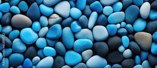 Turquoise pebbles texture on a vintage stone background creating a beautiful sea pebble beach atmosphere