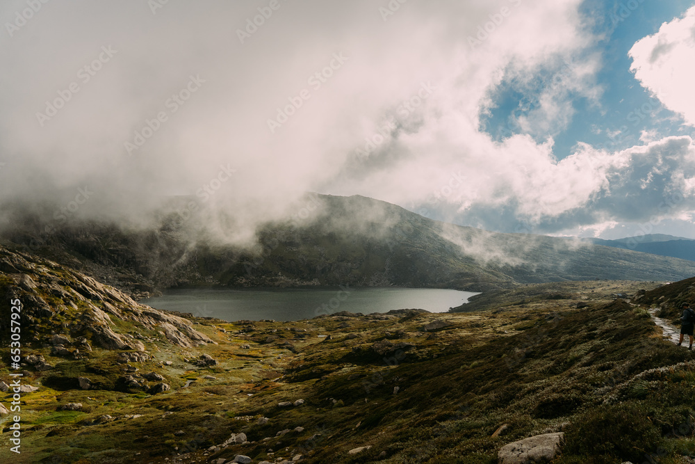 fog in the mountains over a lake