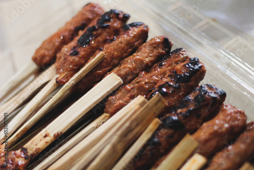 Sate Pusuk, made from beef and shaved coconut that is clenched and grilled photo