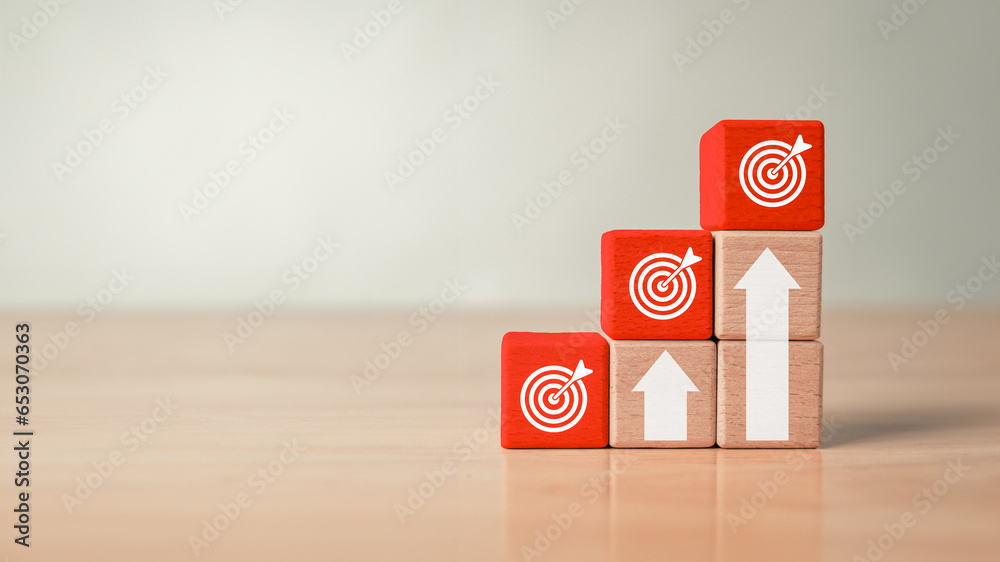Business achievement goal and annual report objective target on wooden blocks banner background. Growing success and development concept. - obrazy, fototapety, plakaty 