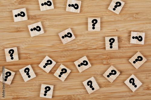 Flat Lay of Wooden Question Marks on a wooden background