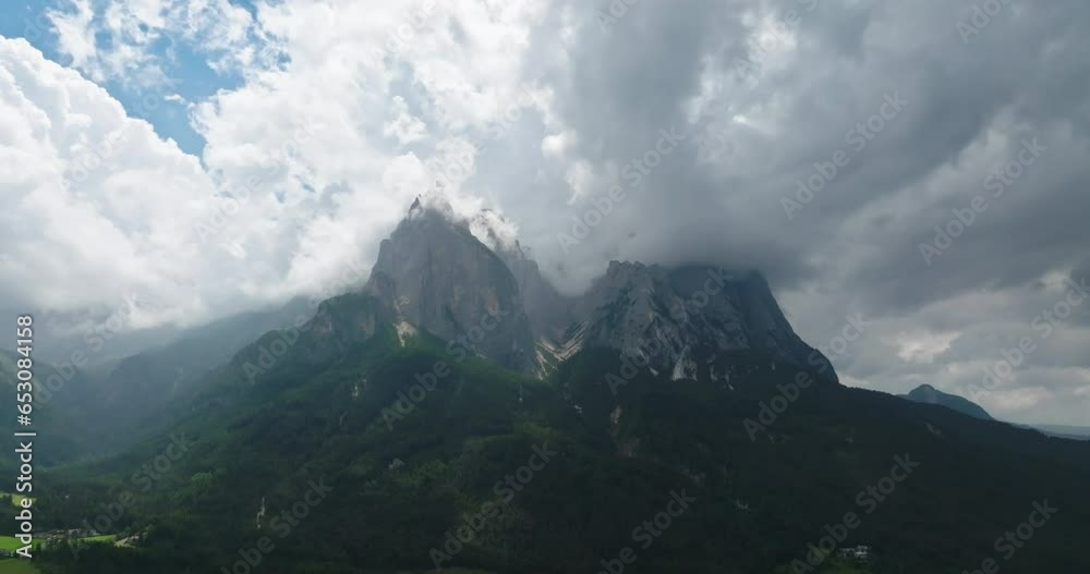 Aerial of Schlern mountain shrouded by clouds, Dolomites, Italy Aerial of Schlern mountain shrouded by clouds, Dolomites, Italy
