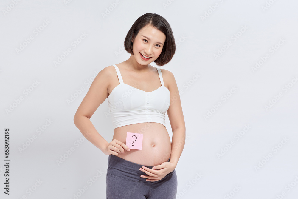Pregnant woman with stick notes on her belly Pregnant woman with stick notes on her belly