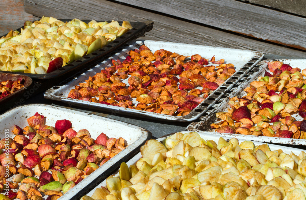 Drying apples in the sun. Drying of natural fruits. Stock Photo Adobe