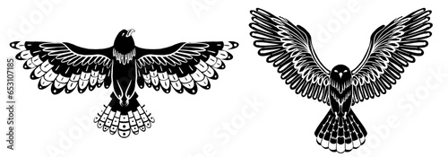 Vector set of black silhouette decorative flying birds. Monochrome cliparts of an owl and hawk with spread wings isolated from background.