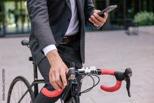 Man using mobile app and unlocking the parking lot photo