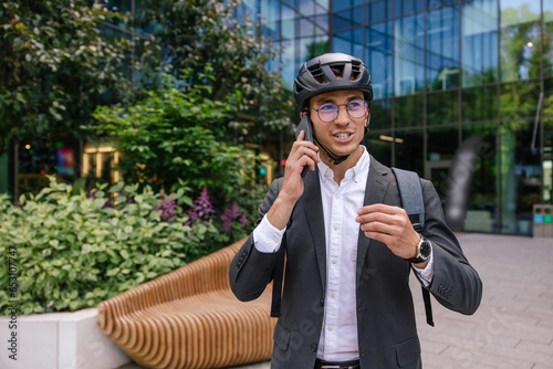 Young handsome man in hemlet talking on the phone photo