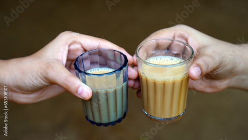 Two Glass of Fresh milk tea or Indian Kadak Chai on hand photo