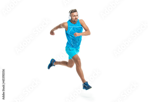 The jogger stretched body before running. sport jogger listen to music in headphones. The jogger ran at sport training isolated on white. In a morning sport workout jogger run in studio