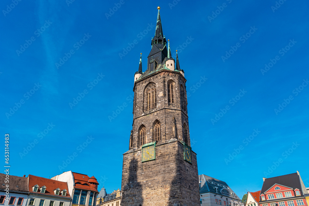 Halle, Saale, Germany,  Red Tower at market square at Church of Our Dear Lady in historical downtown, at blue sky and sunny summer day with copy space