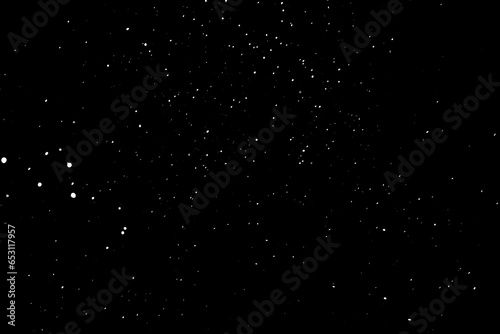 Snow on a black background. Snowflakes in the form of stars. Snowfall.
