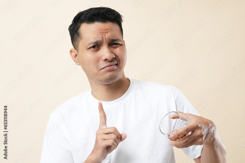 Photo of a young Asian man with Acne Problem Face  Skin allergy. Concept of skin problems.