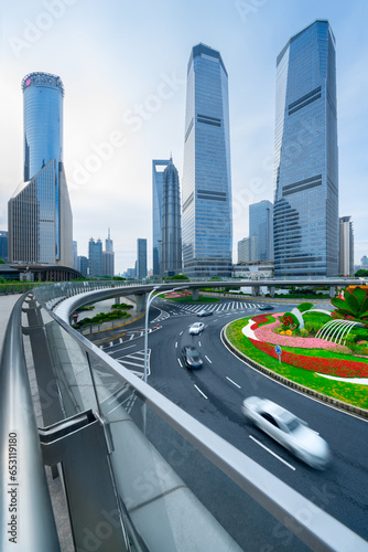 financial buildings in the Bund of Shanghai and moving bus on the highway