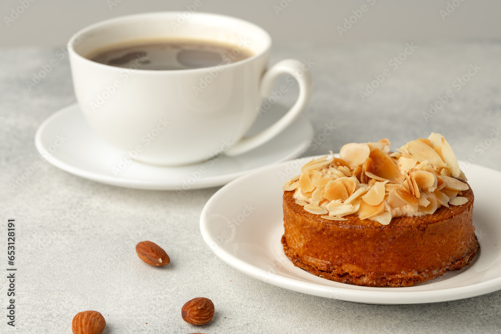 Tart pie with almond petals on plate Tart pie with almond petals on plate
