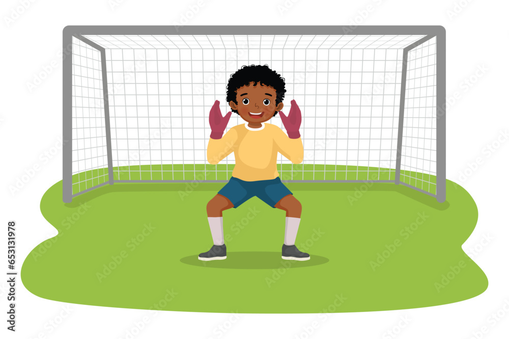 Fototapeta premium Little African boy playing soccer ball as a goalkeeper standing to defend the goal