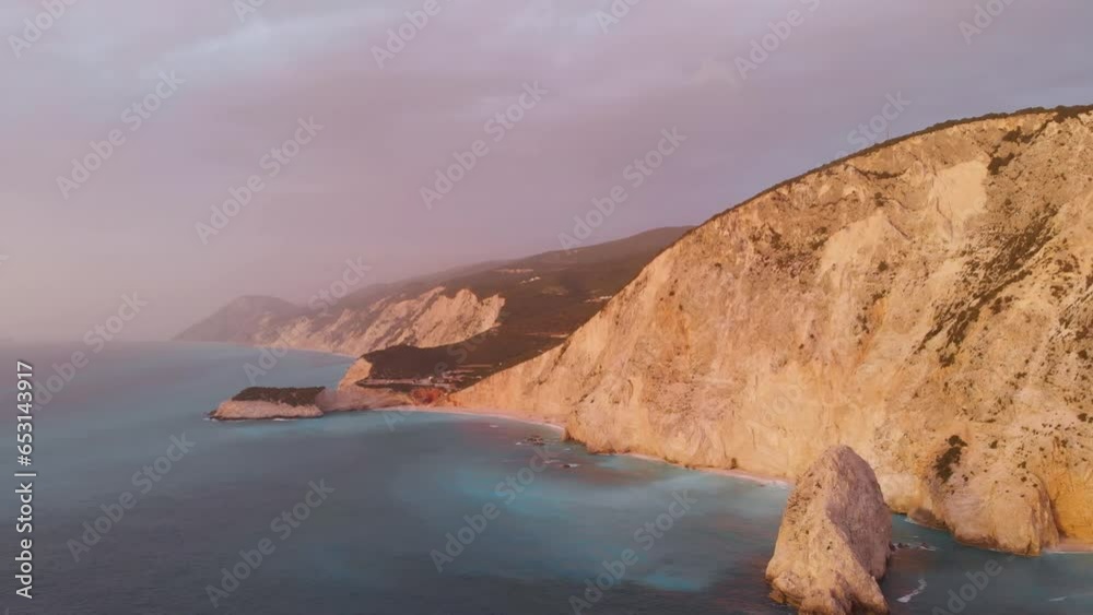 Aerial beautiful beach and water bay in the greek spectacular coast line. Turquoise blue transparent water, unique rocky cliffs, Greece summer top travel destination Lefkada island Aerial beautiful beach and water bay in the greek spectacular coast line. Turquoise blue transparent water, unique rocky cliffs, Greece summer top travel destination Lefkada island