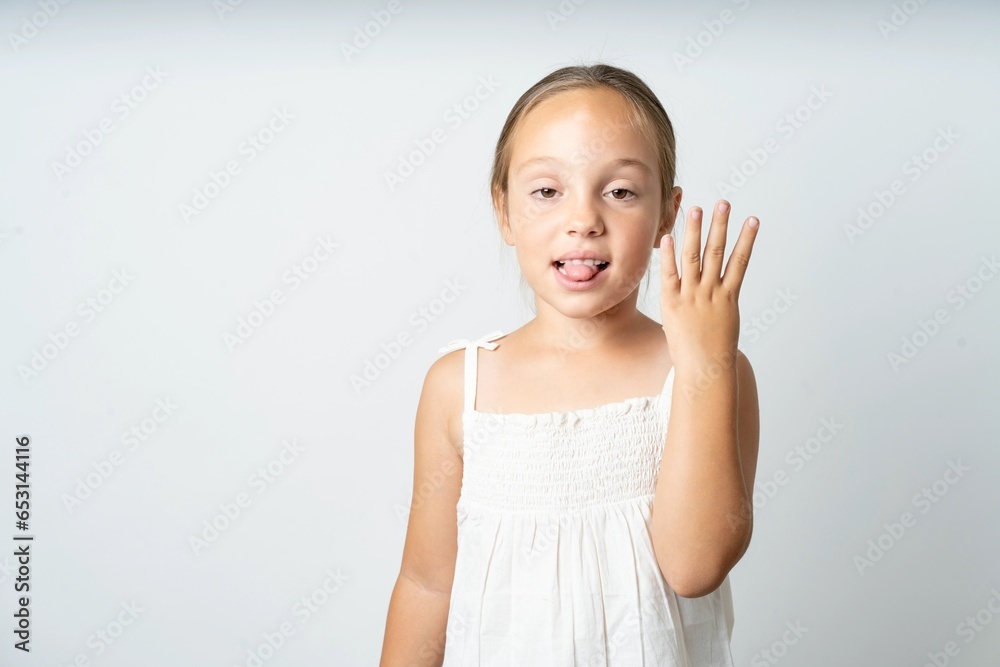 beautiful kid girl wearing white dress smiling and looking friendly, showing number four or fourth with hand forward, counting down beautiful kid girl wearing white dress smiling and looking friendly, showing number four or fourth with hand forward, counting down