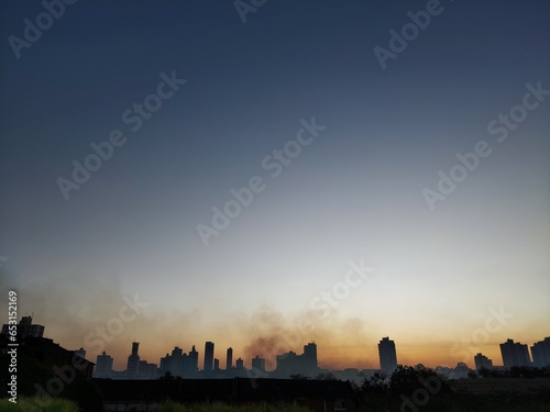 city burning in sunrise over the city