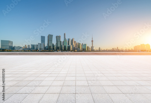 financial district buildings of shanghai and empty floor at sunset
