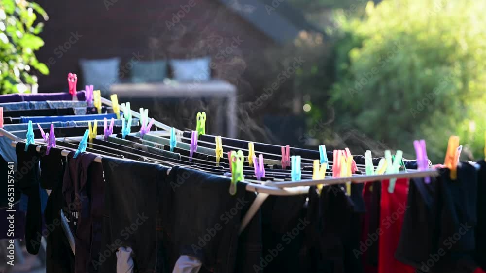 Water vapor evaporation from wet laundry in the sunlight.