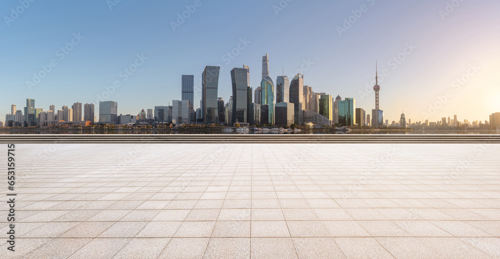 financial district buildings of shanghai and empty floor at sunset