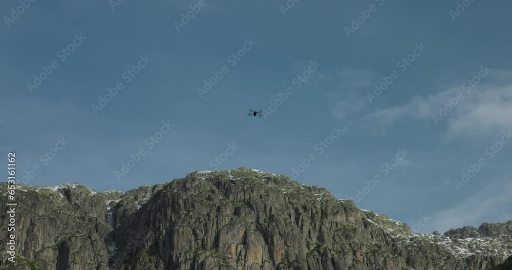 Drone Silhouette Films Mountain Top Against Blue Sky Drone Silhouette Films Mountain Top Against Blue Sky