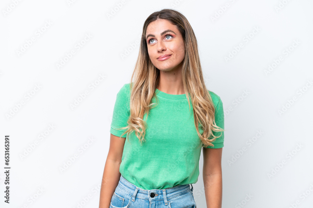 Young Uruguayan woman isolated on white background thinking an idea while looking up Young Uruguayan woman isolated on white background thinking an idea while looking up