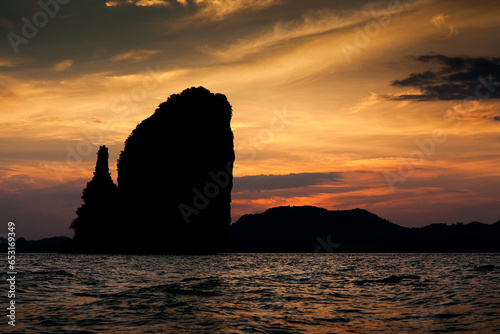 A silhouette of an Island in Thailand as the sun sets. 