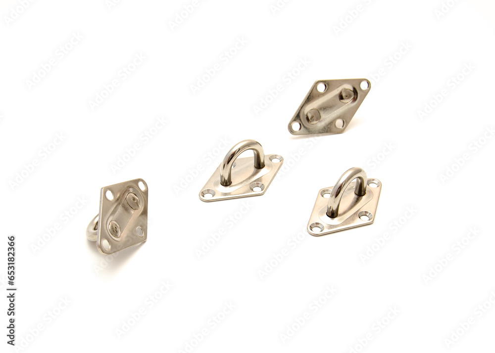 Four pad eyes in sun shade sail hardware kit that a line cable wire chain runs through, provides an attachment point heavy duty stainless steel isolated on white background Four pad eyes in sun shade sail hardware kit that a line cable wire chain runs through, provides an attachment point heavy duty stainless steel isolated on white background