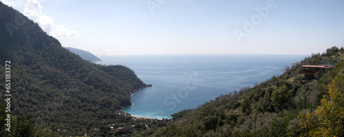 A glued wide angle panoramic photo of coastal landscape of Mediterranean sea at Kalabantia. Amazing seascape of Lycian way: high rock cliffs, mountain ridge, rugged shoreline, blue lagoon. 