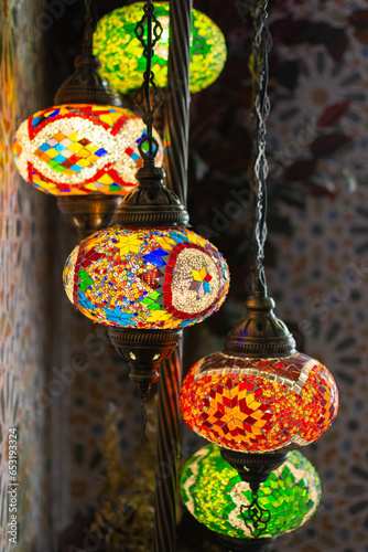 Handcrafted Moroccan mosaic floor lamps at the market photo