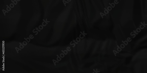 Dark crumple black fabric paper wrinkled poster template ,blank glued creased paper texture background. black paper crumpled backdrop background. used for cardboard and clarkboard.