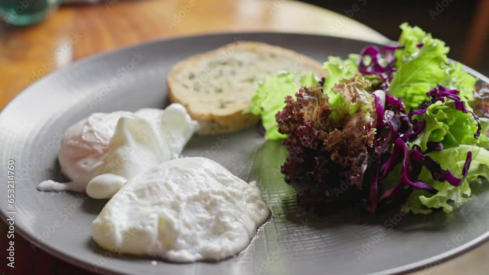 Poached eggs breakfast dish with bread and salad Healthy breakfast or lunch food Poached eggs breakfast dish with bread and salad Healthy breakfast or lunch food