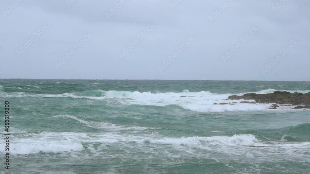 waves crashing on rocks