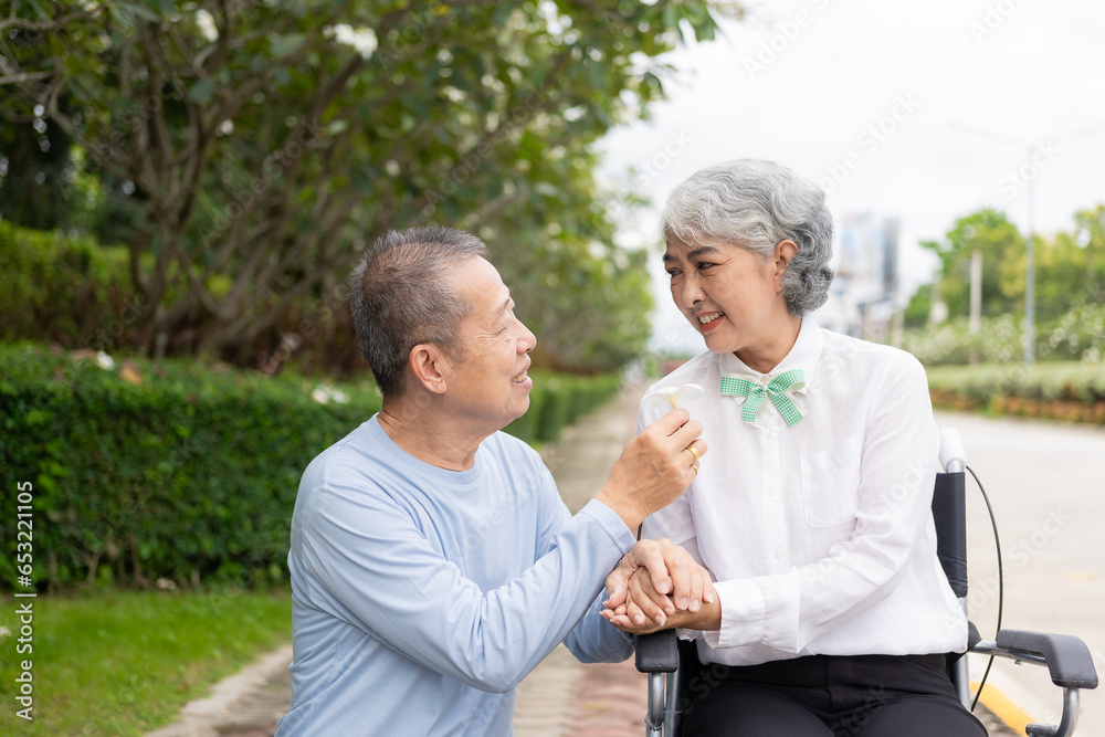 Senior Asian couple playing and teasing each other Happy family concept together outside the house Enjoy a fun lifestyle during retirement. Family health care Senior Asian couple playing and teasing each other Happy family concept together outside the house Enjoy a fun lifestyle during retirement. Family health care