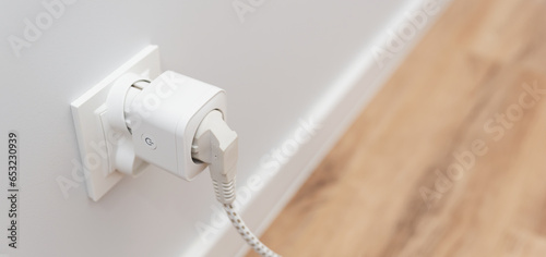 Schilderij op canvas Using smart socket on the wall in a smart home